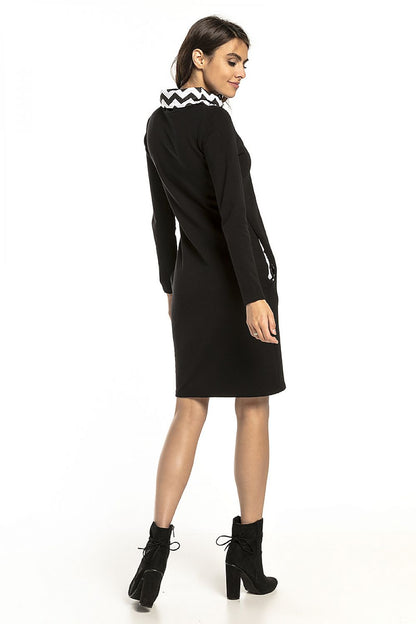 Sophisticated rear view of the Tessita fitted knit sweatshirt dress, showcasing the stylish patterned collar and hip seam pockets.