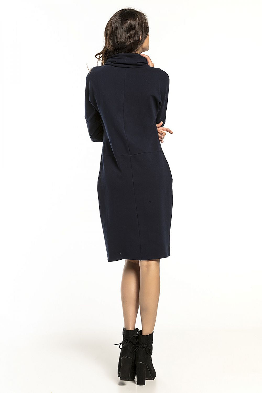 Back view of Tessita luxurious long-sleeved turtleneck daydress in soft knit, showcasing a chic and comfortable design, blending elegance with casual wear.