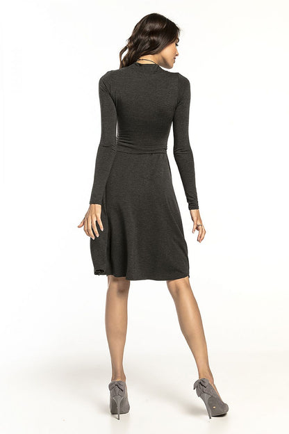 Rear view of the luxurious Tessita long-sleeved turtleneck dress in airy viscose knit, showcasing the flared skirt and stylish silhouette.