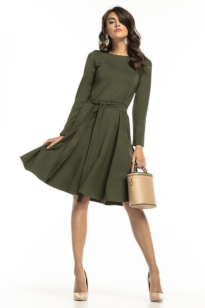 Chic Tessita knit dress in olive green with long sleeves and a flared hem, ideal for elegant outings and everyday wear.