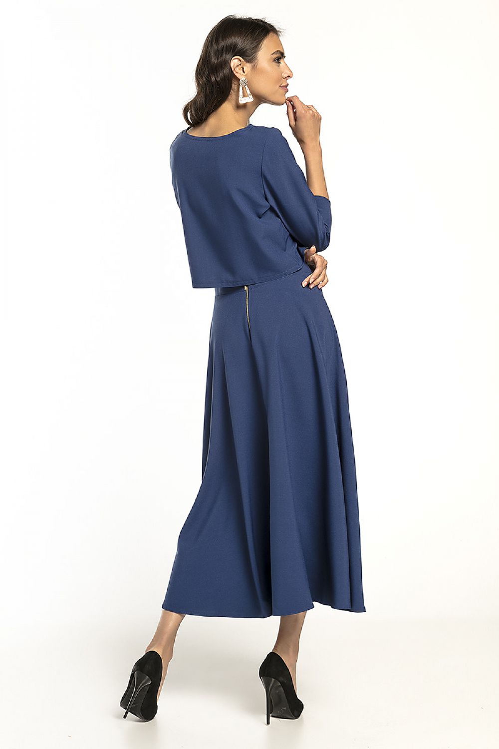 Elegant Tessita waist-length blouse with 3/4 sleeves, showcased in a stunning deep blue outfit, perfect for both casual and formal occasions.