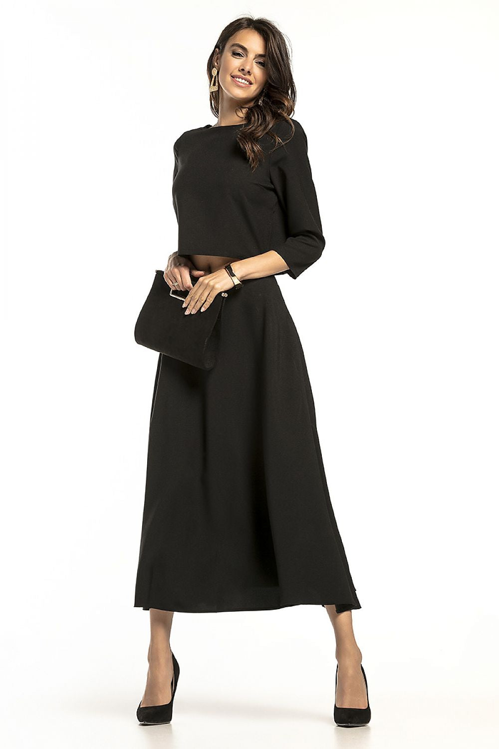 Chic Tessita waist-length blouse with half-round neckline, elegantly styled in a sleek black ensemble, ideal for sophisticated gatherings.