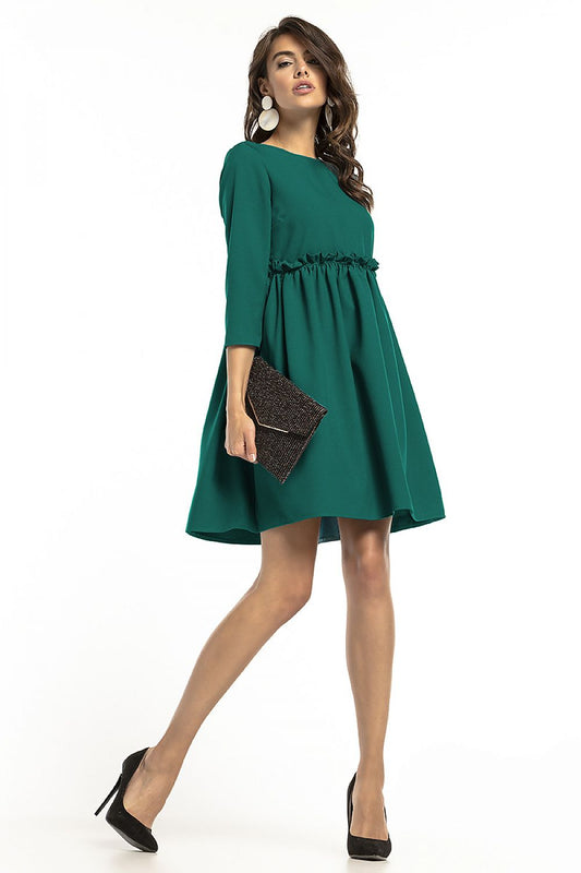 Elegant Tessita 3/4 sleeve daydress featuring a yoke and delicate frill detail, showcased on a model in a lush green hue, perfect for versatile styling.