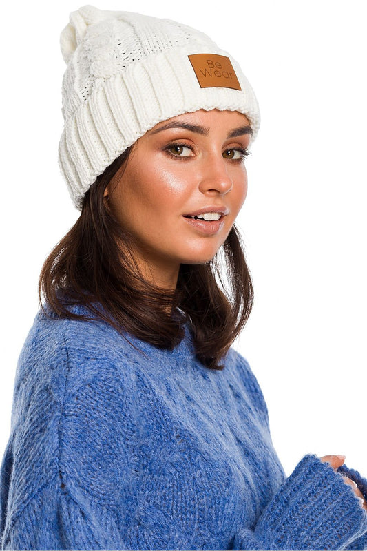 Luxurious BE Knit Plaid Beanie - A soft 100% acrylic hat with a flip-up bottom and logo patch, perfect for stylish winter wear.
