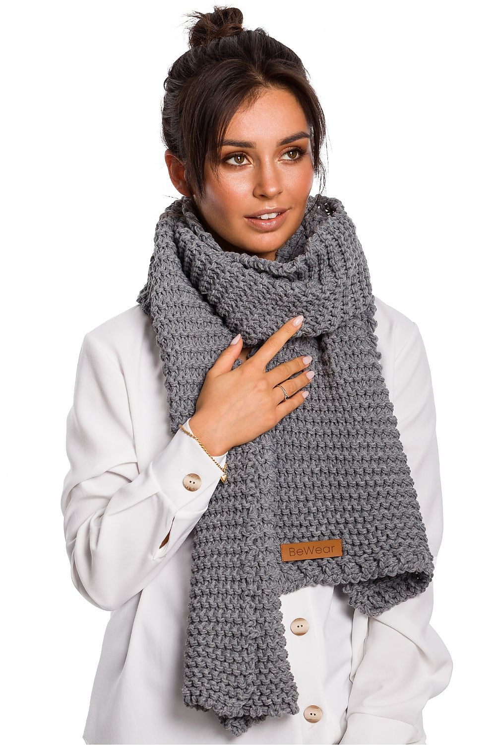 BE Knit luxury acrylic shawl available in various sizes, showcasing a chic logo patch for fashionable cold weather styling.