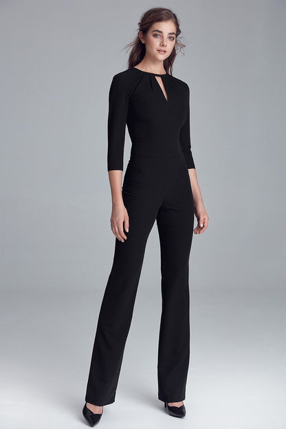 Elegant Fitted Jumpsuit by Nife, featuring 3/4 sleeves and a charming neckline, made from a soft viscose blend.
