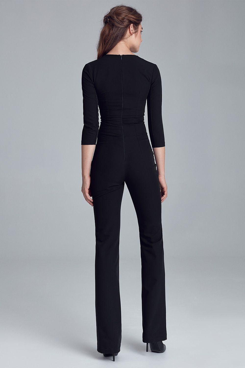 Stunning Nife fitted jumpsuit with elegant 3/4 sleeves and a fashionable neckline, designed in a soft viscose blend for comfort and style.