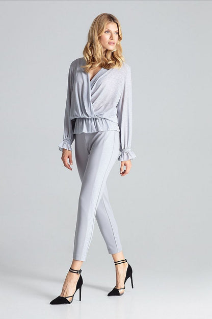 Detail of the elastic band at the waist of the Luxury Red Brocade Blouse by Figl, highlighting its stylish and flattering fit.