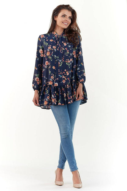 Elegant Long Sleeve Blouse by Infinite You featuring floral design, long sleeves, and a sophisticated ruffled hem, perfect for a chic polished look.