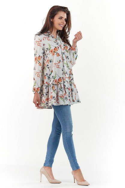 Side view of the Elegant Long Sleeve Blouse by Infinite You, featuring a chic design with elegant floral motifs and a graceful silhouette.