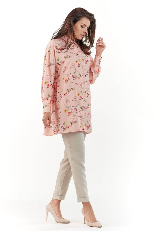 Profile view of the Elegant Long Sleeve Shirt with Charming Crease, exquisitely patterned, worn with chic beige trousers, embodying luxury fashion.