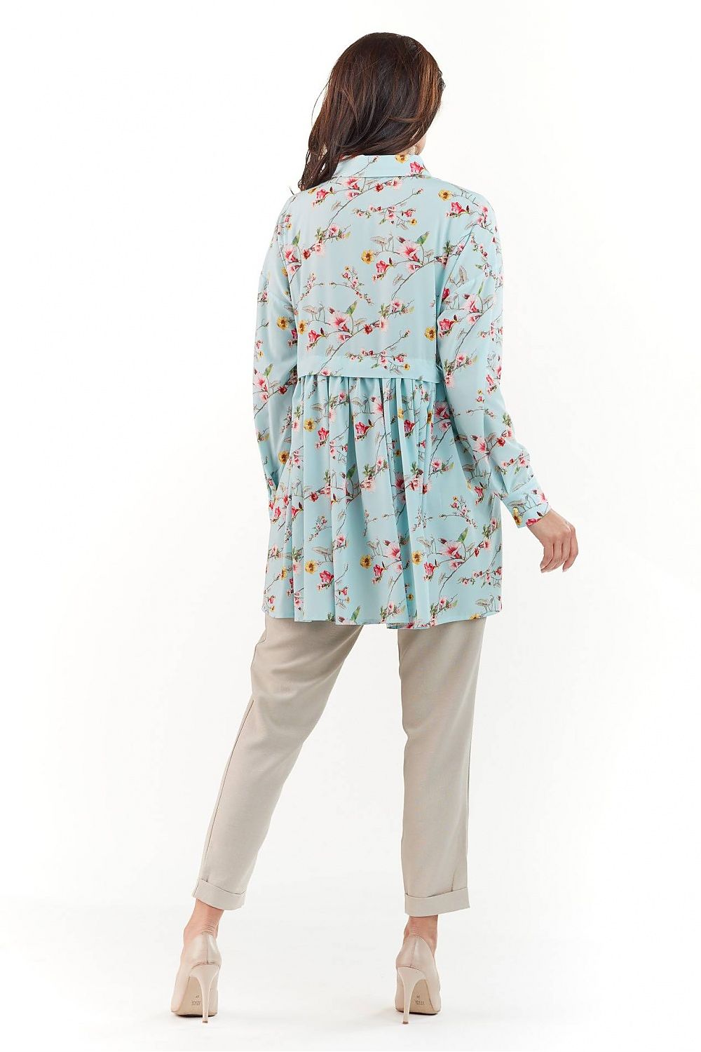Elegant Long Sleeve Shirt with Charming Crease. The back view of a model wearing a floral patterned shirt, delightfully designed with a charming crease, paired with chic trousers, highlighting luxurious style.