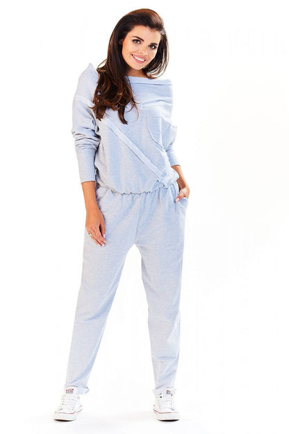 Elegant Loose-Fitting Tracksuit With Boat Neckline by Infinite You, showcasing a model smiling while wearing a stylish light grey tracksuit, perfect for comfort and elegance.