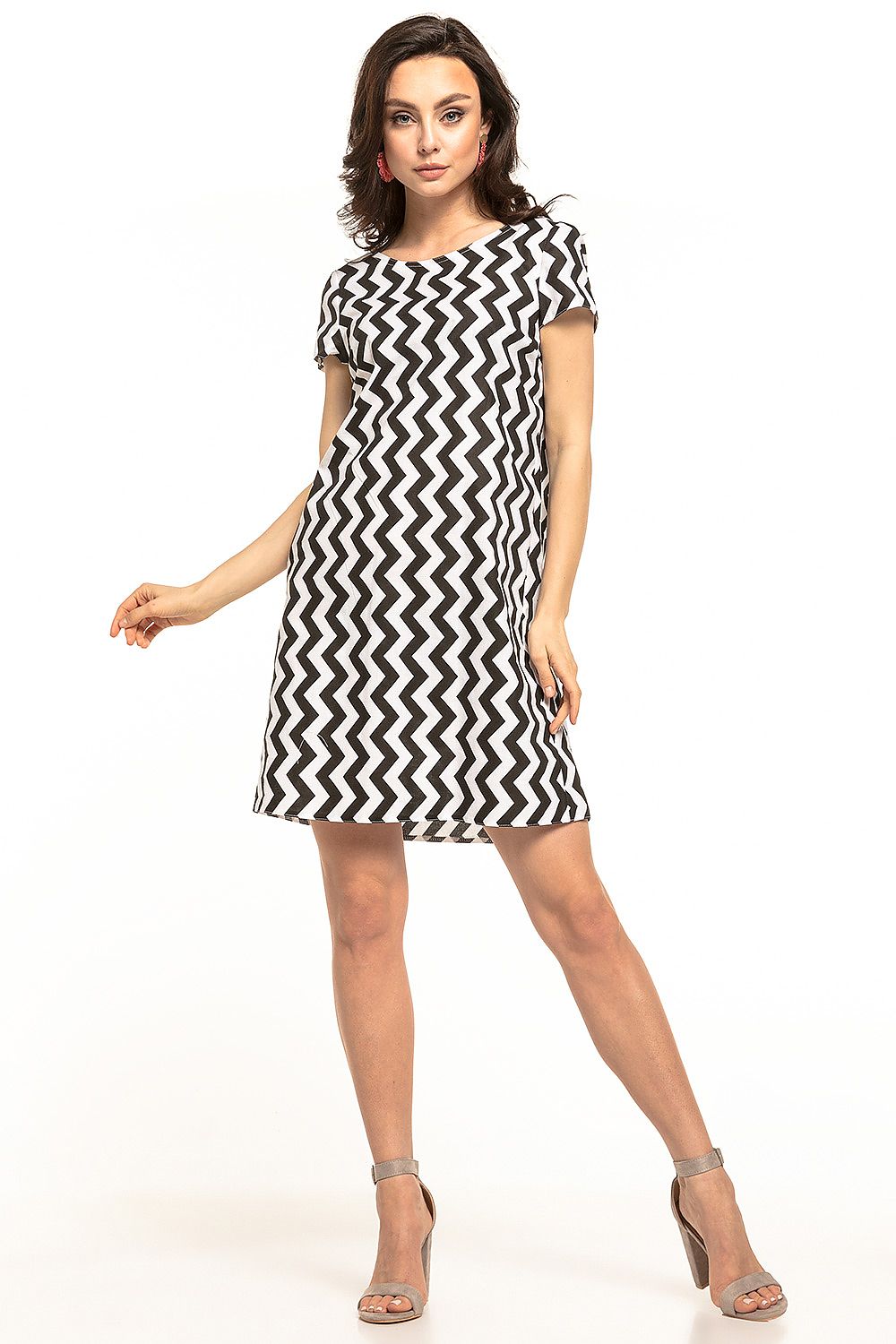 Tessita mini dress featuring a chic zigzag pattern, boat neckline, and double ruffle detail at the back, showcasing a stylish and flattering silhouette. Perfect for a girly and elegant appearance.