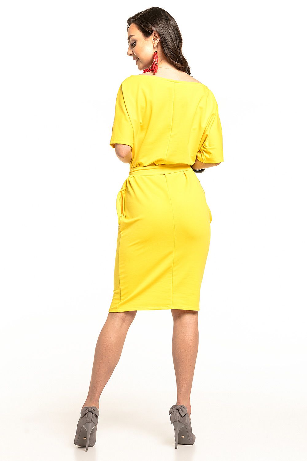 Back view of the luxurious yellow midi dress by Tessita, showcasing its kimono sleeves and cinched silhouette.