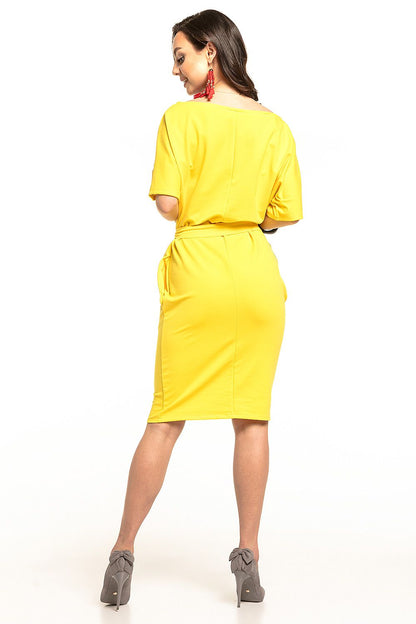 Back view of the luxurious yellow midi dress by Tessita, showcasing its kimono sleeves and cinched silhouette.