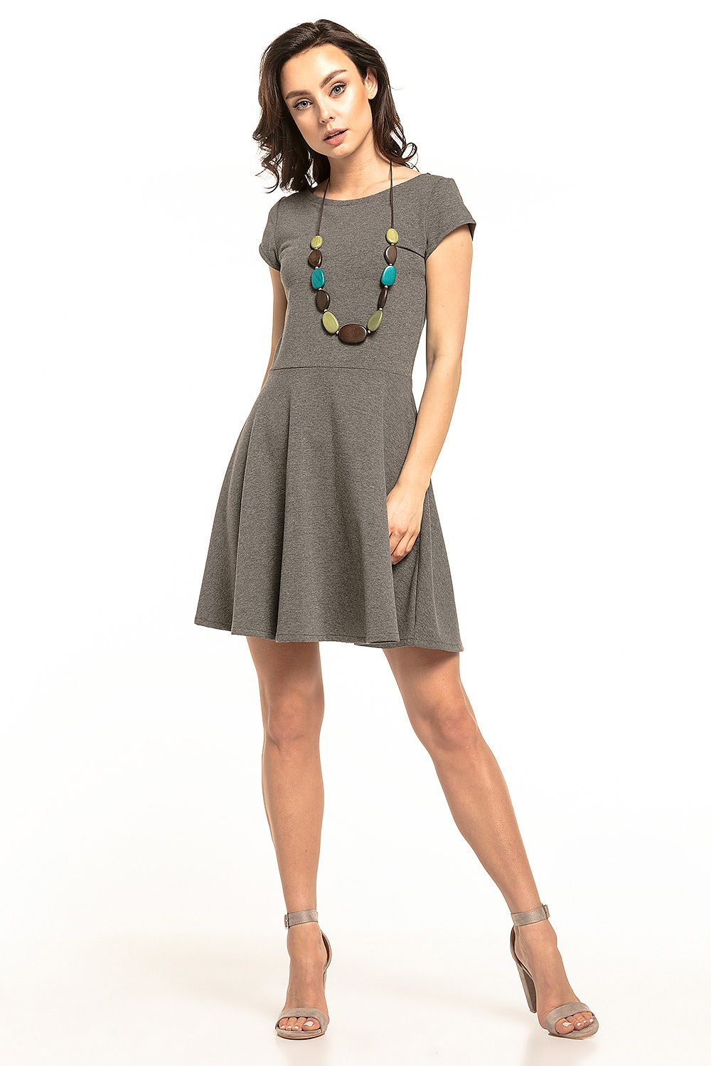 Chic grey Tessita midi dress with a flared skirt and short sleeves, elegantly styled with statement necklace for an upscale everyday look.