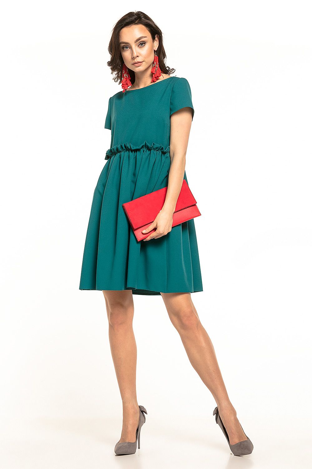 Stunning mini daydress by Tessita in deep teal, showcasing a boat neckline and stylish ruffles, complemented by vibrant red accessories for a glamorous look.