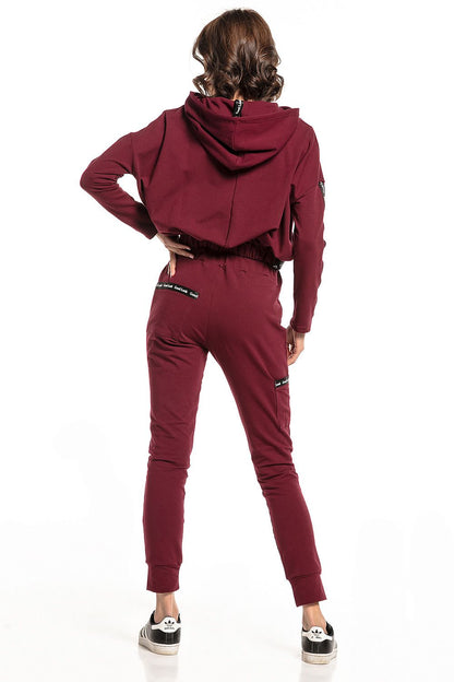 Back view of model wearing Burgundy Luxury Tessita straight-cut tracksuit trousers paired with a cropped hoodie, highlighting the chic design and practical features.