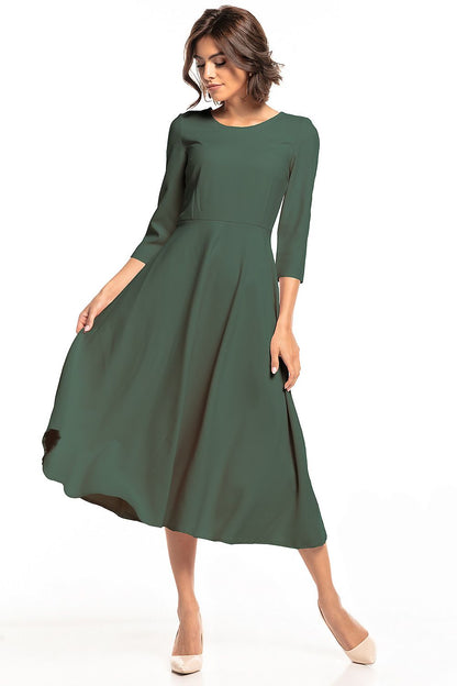 Elegant Tessita lightweight maxi dress showcasing a graceful fit, perfect for versatile occasions. The dress features a covered zipper and a flowing silhouette, accentuating feminine charm.