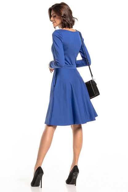 Chic and sophisticated flared daydress by Tessita, highlighted by its stylish sweetheart neckline and functional pockets for ultimate style and comfort.