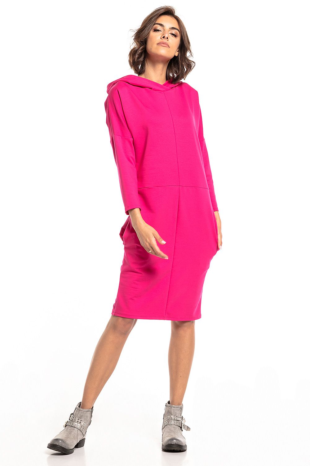 Elegant Tessita Knit Hooded Dress showcasing stylish slashes and practical seam pockets in a luxurious cotton blend.