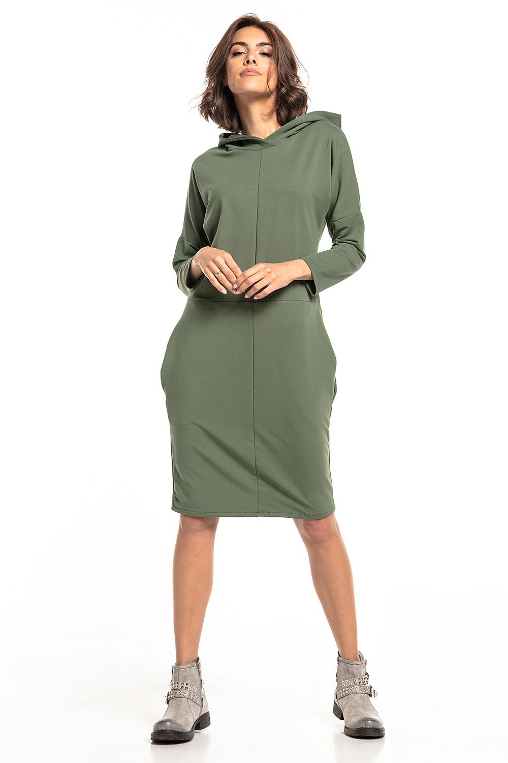 Stylish Tessita Knit Hooded Dress, emphasizing luxury and comfort with fashionable slashes and convenient pockets.