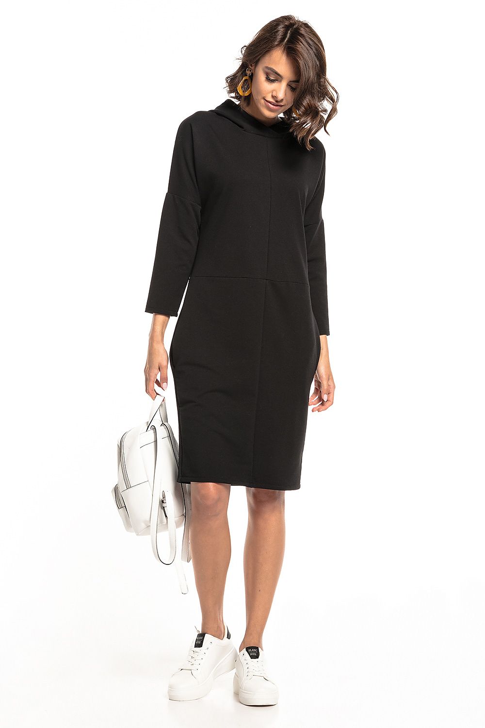 Stylish Tessita Knit Hooded Dress, designed with slashes and functional seam pockets for sophisticated comfort.