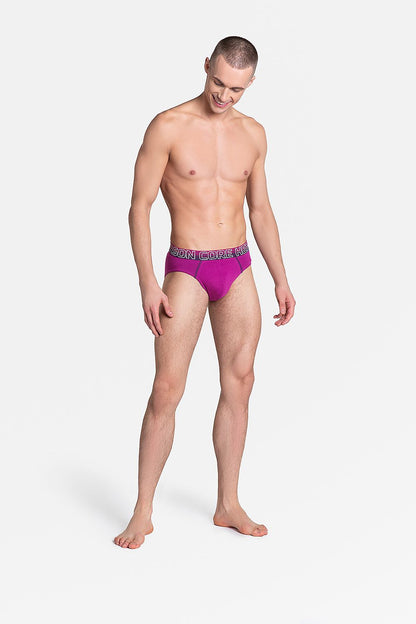 Luxury Henderson Men’s Briefs Set showcasing a model in vibrant pink briefs with a stylish rubber waistband. Perfectly crafted for comfort and individuality, featuring quality cotton and spandex blend for a sporty style.