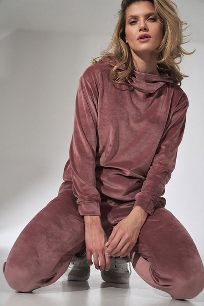 Close-up of a woman modelling the Figl Pink Velour Tracksuit Trousers with Tapered Legs and Drawstring Waist, capturing the plush texture and modern tapered design.