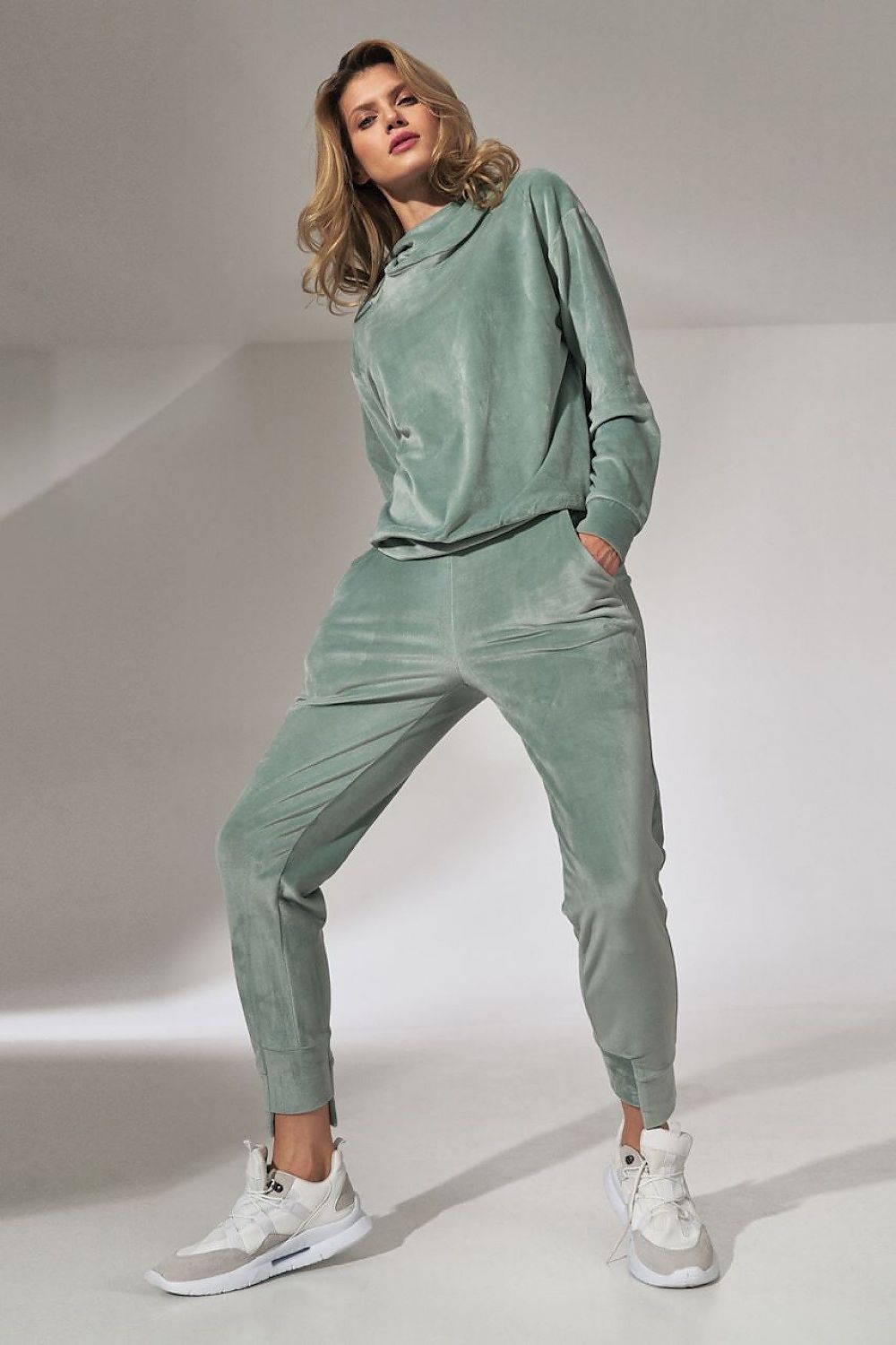 Elegant Figl Pink Velour Tracksuit Trousers with Tapered Legs and Drawstring Waist in a soothing green shade, exuding comfort and style.