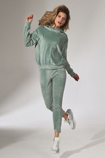 Beautifully designed Figl Pink Velour Tracksuit Trousers with Tapered Legs and Drawstring Waist, displayed in a fashionable pose highlighting the velour fabric.
