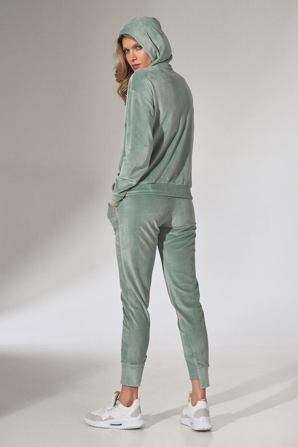 Sophisticated Figl Pink Velour Tracksuit Trousers with Tapered Legs and Drawstring Waist, exemplified in a fashionable perspective, featuring a subtle yet elegant design.