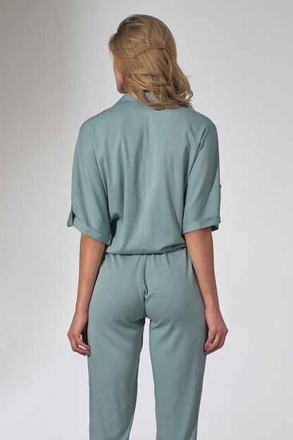 Rear view of the luxurious Orange Kimono Blouse With Heart Neckline And Decorative Cuffs By Figl, highlighting the unique design and soft fabric.