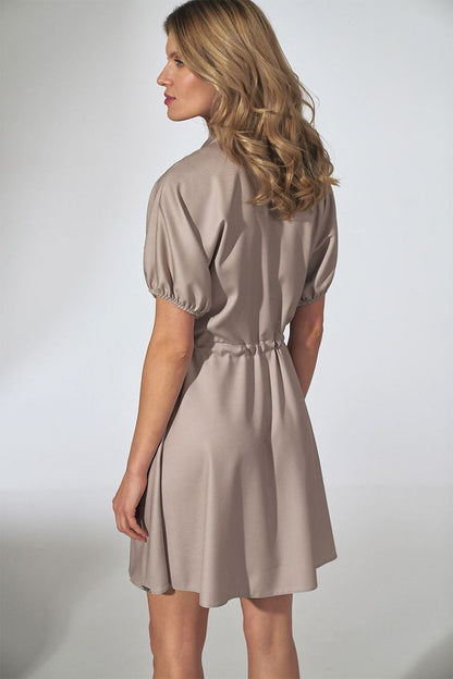 Back view of the Elegant Orange Kimono Mini Dress with Collar, Flared Bottom and Side Pockets by Figl, highlighting the dress's design and fitted waist.