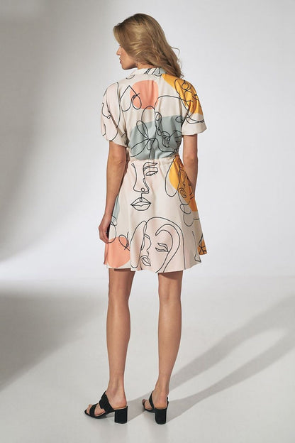 Captivating view from the back of the orange kimono mini dress with collar, flared bottom and side pockets by Figl, demonstrating its elegant cut and luxurious fabric.