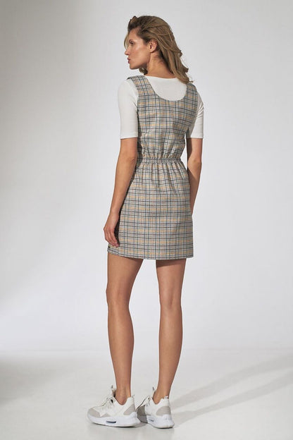Back view of the Figl Checked Midi Dress with Decorative Buttons and Pockets, highlighting the tailored design and comfortable fit on a model.