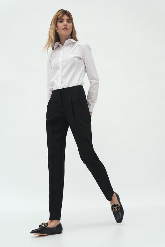 Elegant Long Sleeve Cotton Blend Shirt by Nife - Classic Fit with Two-Button Sleeves styled with tailored trousers, embodying luxury and elegance in a fashion-forward pose.