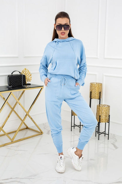Elegant Luxurious Vittoria Ventini 2-Piece Knitted Tracksuit Set in a soft blue hue, designed with a trendy hoodie and tapered trousers, ideal for a sophisticated casual look.