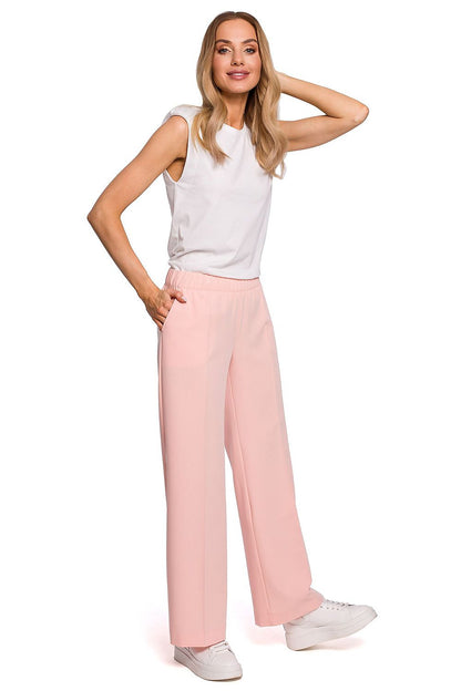 Elegant Wide Leg Trousers with Pleats and Elastic Waistband by Moe, styled in soft pink, showcasing a model in a trendy outfit, perfect for combining comfort and chic fashion.