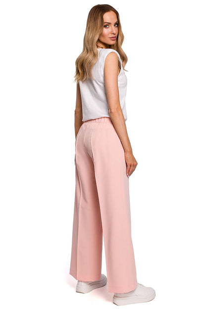 Back view of the Elegant Wide Leg Trousers with Pleats and Elastic Waistband by Moe, highlighting the relaxed fit and luxurious fabric, ideal for sophisticated casual wear.