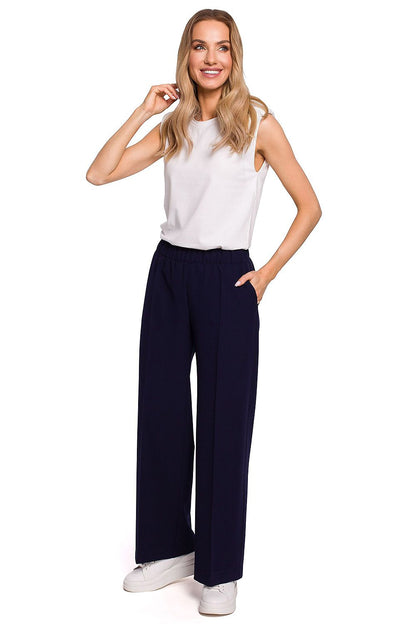 Elegant Wide Leg Trousers with Pleats and Elastic Waistband by Moe, displayed in a deep navy hue, featuring a stylish model in a fashionable ensemble that epitomises elegance and comfort.