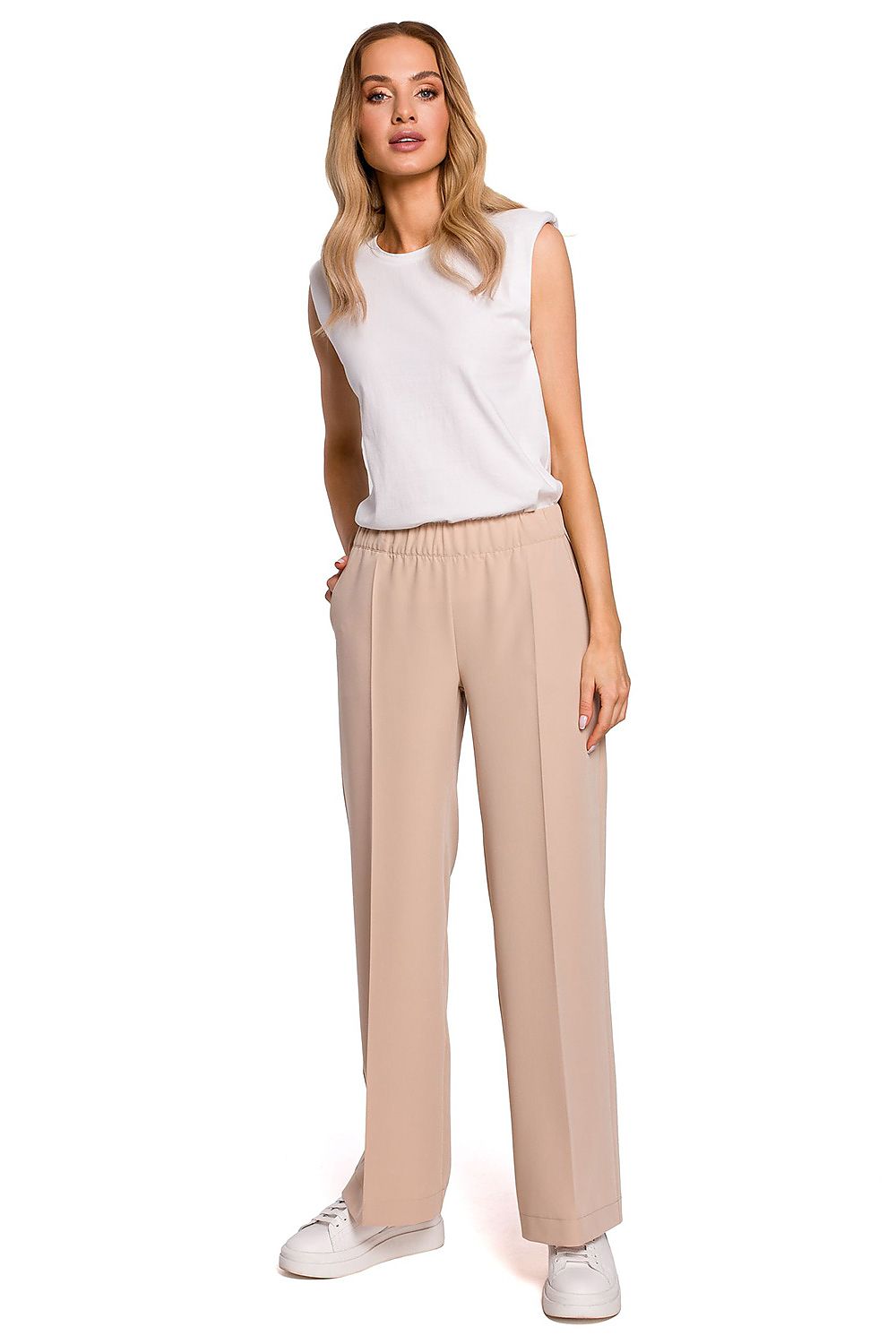 Chic front view of Elegant Wide Leg Trousers with Pleats and Elastic Waistband by Moe in a sophisticated beige colour, worn by a fashion model.
