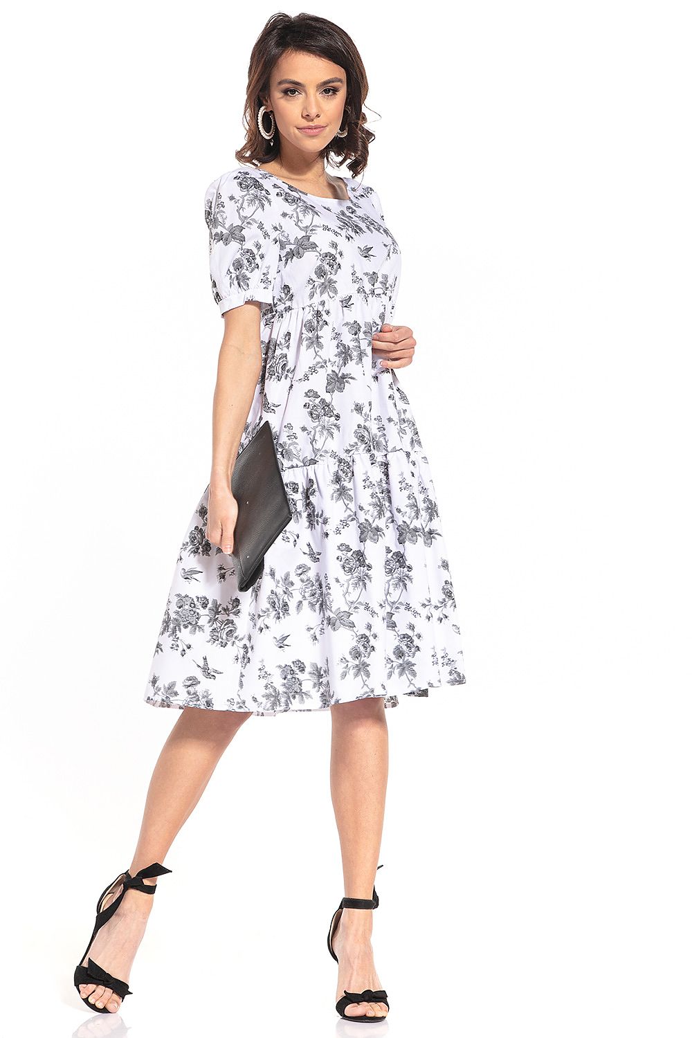 Elegant dark moro patterned midi dress by Tessita featuring a sophisticated boat neckline and sumptuous buffet sleeves.