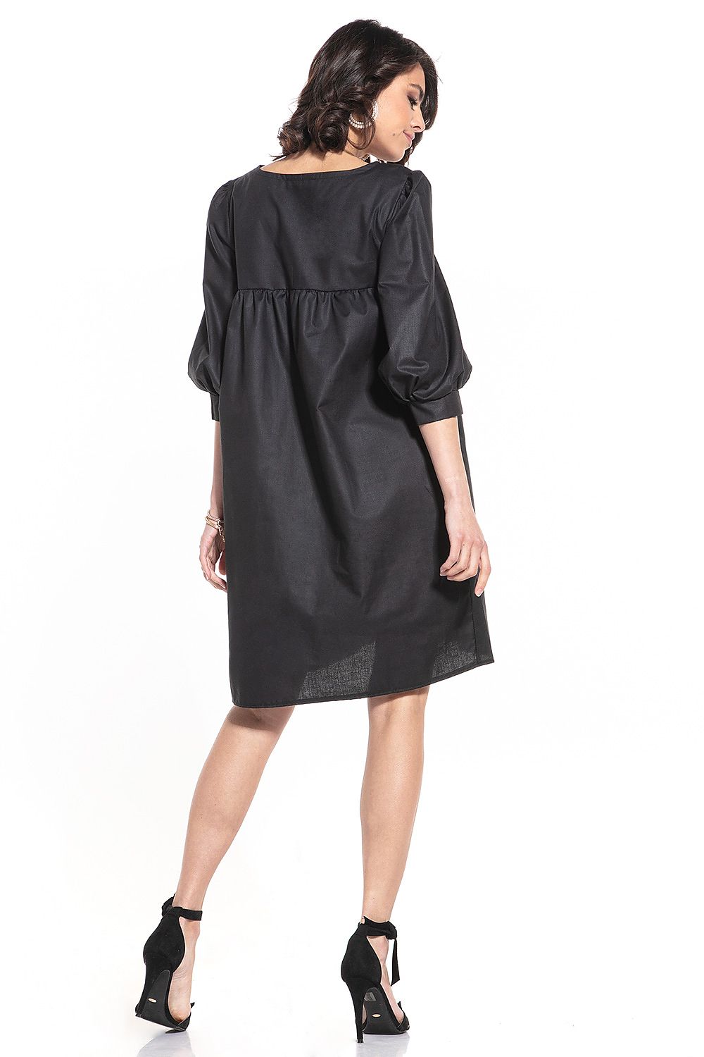 Detail shot of the Tessita luxury midi dress showcasing its 100% cotton fabric and intricate cuff design on the 3/4-length sleeves.