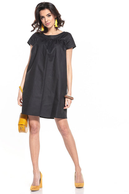 Elegant Cotton Mini Dress by Tessita with a sophisticated boat neckline and stylish short sleeves, perfect for a chic summer look.