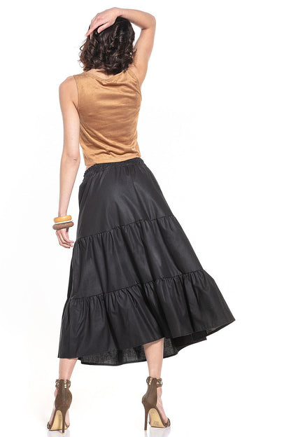 Luxurious Tessita cotton skirt showcasing its flowing silhouette and premium fabric, perfect for stylish summer outings.