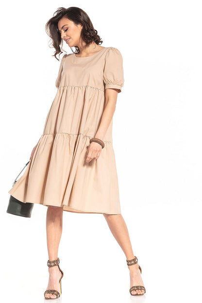 Elegant Tessita midi dress featuring a sophisticated boat neckline and luxurious short buffet sleeves in 100% cotton.