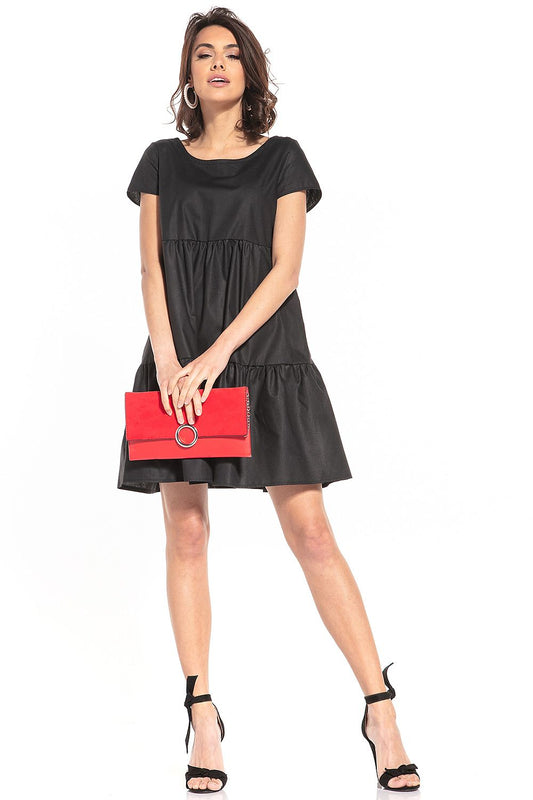 Elegant cotton mini dress by Tessita featuring a sophisticated boat neckline and short sleeves, perfect for summer events.