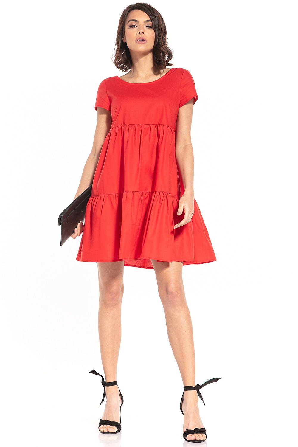 Model wearing the Tessita elegant mini dress, highlighting the stylish boat neckline and flattering short sleeves.